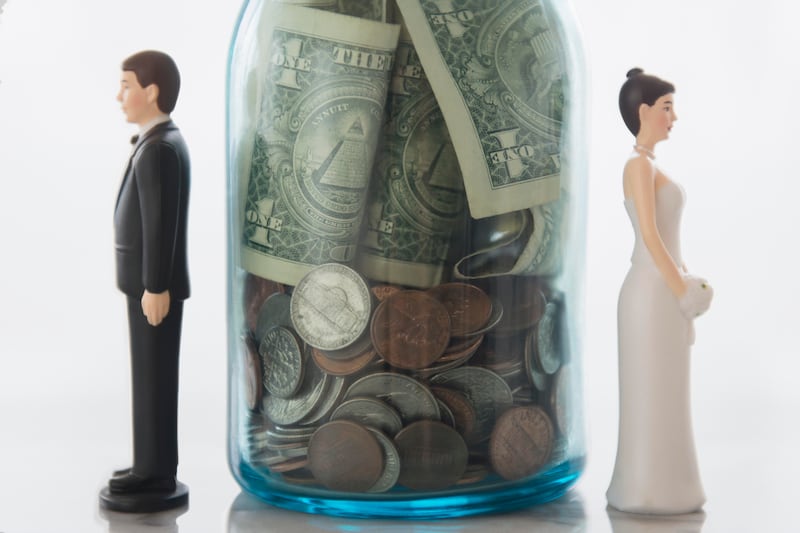 A separation of finances after a divorce may mean changing your spending habits and adapting to a new budget. Getty Images