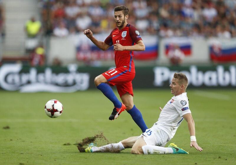England’s Adam Lallana in action with Slovakia’s Tomas Hubocan during the European World Cup qualifying match. Carl Recine / Action Images / Reuters