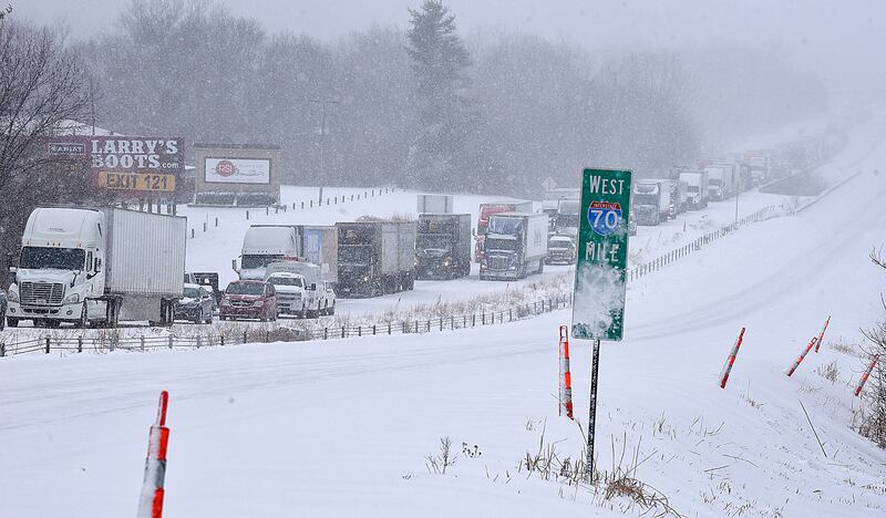 Traffic along eastbound Interstate 70 grinds to a halt in Columbia, Missouri, following several accidents after a winter storm dumped several centimetres of snow. AP