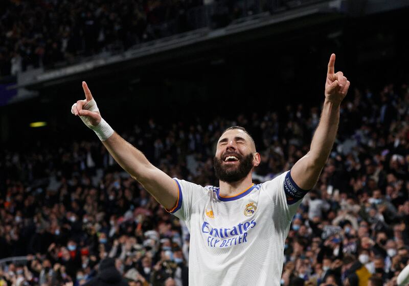 Real Madrid's Karim Benzema celebrates scoring his third goal to secure an incredible 3-1 win against PSG in the Champions League last 16. Reuters