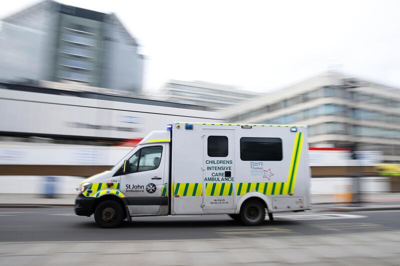 A St John Ambulance passes St Thomas' Hospital in London. Patient demand for the London Ambulance Service is "now arguably greater" than during the first wave. The UK is experiencing a surge in Covid-19 cases. Getty Images