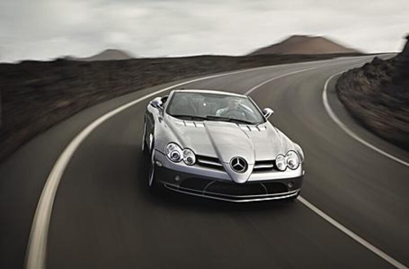 Without the roof, the staccato roar of the Mercedes McLaren SLR's 5.5L V8 can be fully enjoyed, but the driver and passenger will still be able to hold a conversation.