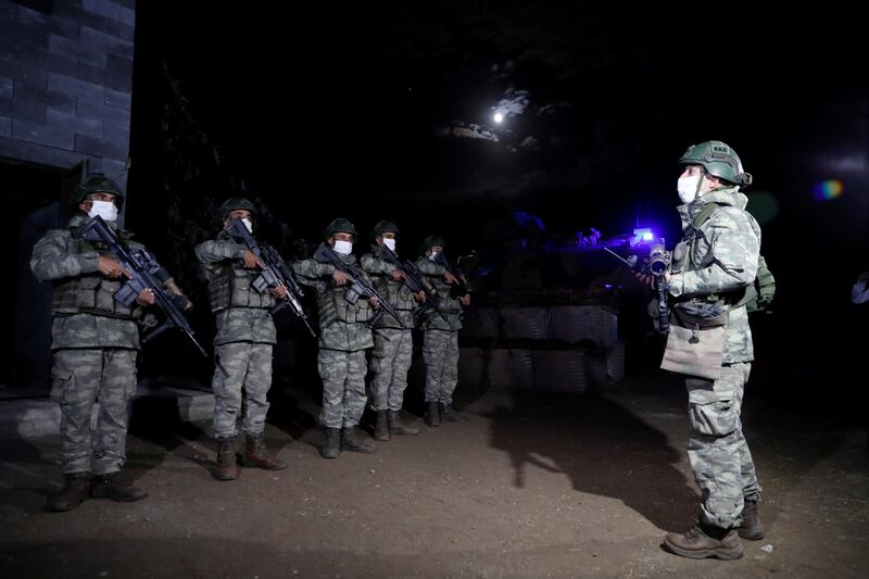 Turkish soldiers get ready for a night patrol on the Turkish-Iranian border in Van. Reuters