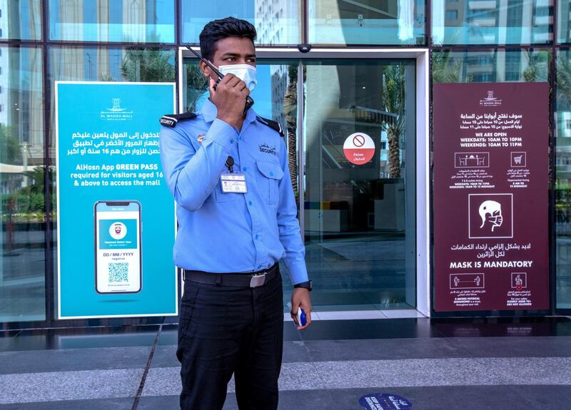 Al Hosn Green Pass awareness signages are put up at the Al Wahda Mall, Abu Dhabi on June 14th, 2021. The new Covid-19 restrictions start tomorrow. Victor Besa / The National.