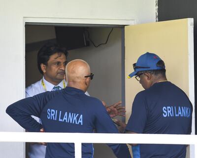 Match Referee Javagal Srinath (L) talks to Asanka Gurusinha (R) and Chandika Hathurusingha (C) of Sri Lanka during day 3 of the 2nd Test between West Indies and Sri Lanka at Daren Sammy Cricket Ground, Gros Islet, St. Lucia, on June 16, 2018. / AFP / Randy Brooks
