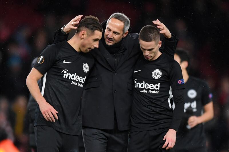 Dominik Kohr, Adi Hutter, coach of Eintracht Frankfurt, and Mijat Gainovic celebrate following their side's victory. Getty