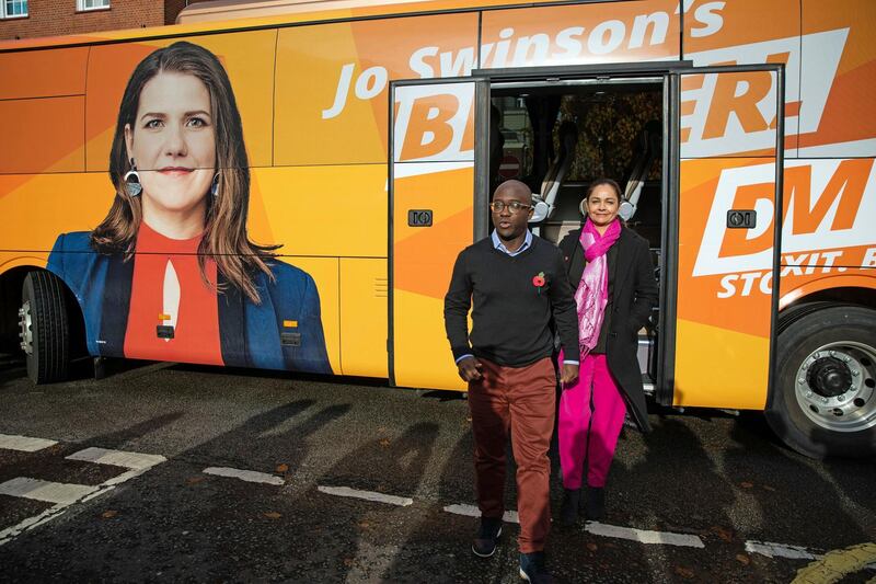 Liberal Democrat Shadow Business, Energy and Industrial Strategy Secretary Sam Gyimah and London Mayoral candidate, Siobhan Benita, arrive to visit to WhiteHat, a tech startup company, as part of the General Election campaign trail, in London, Monday Nov. 11, 2019. Britain goes to the poll on Dec. 12. (Aaron Chown/PA via AP)