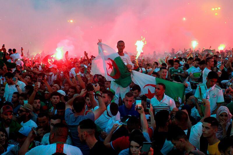 Algerian fans celebrate after their team won the 2019 Africa Cup of Nations final between Senegal and Algeria, in Algiers.  AFP