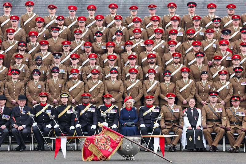 Britain's Queen Camilla poses with the Royal Lancers at  Catterick Garrison, northern England, for her first visit to the regiment since being appointed its Colonel-in-Chief. AFP