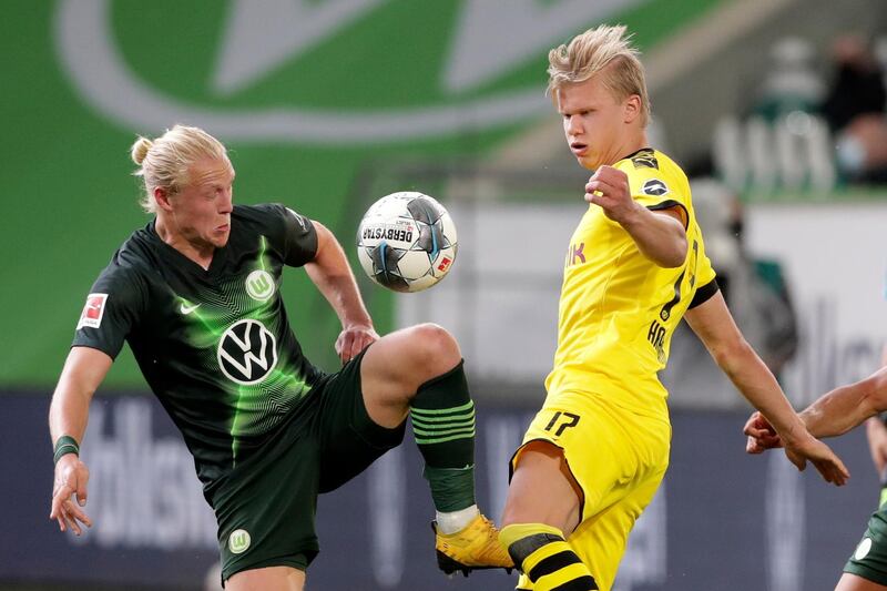 Wolfsburg's Xaver Schlager challenges Dortmund's Erling Haaland. EPA