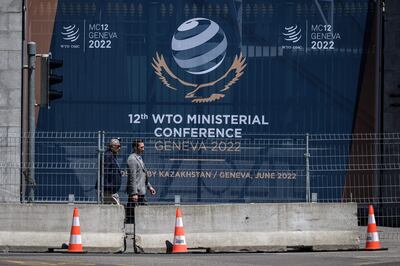 People enter the headquarters of the World Trade Organisation on the eve of the WTO Ministerial Conference in Geneva on Saturday. AFP