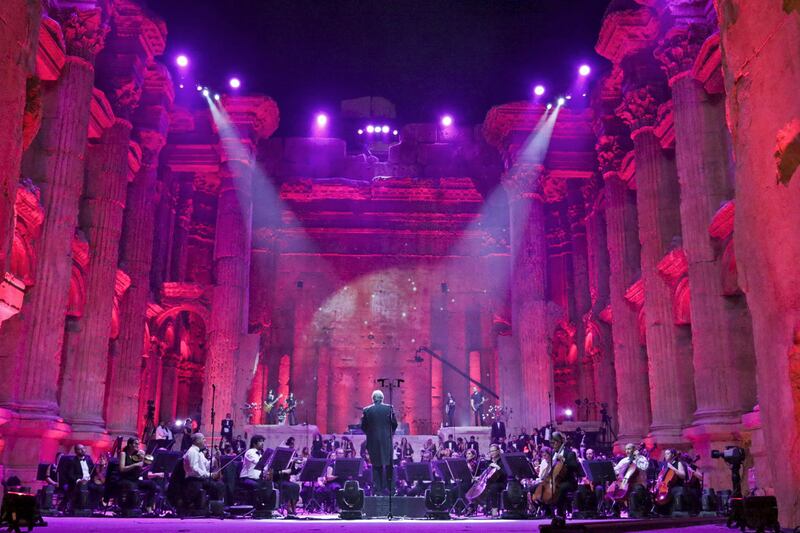 Maestro Harout Fazlian conducts rehearsals ahead of the Sound of Resilience concert inside the Temple of Bacchus at the historic site of Baalbek in Lebanon's eastern Bekaa Valley, on July 4, 2020. - The Lebanese philharmonic orchestra performed to spectator-free Roman ruins in east Lebanon, after a top summer festival downsized to a single concert in a year of economic meltdown and COVID-19 pandemic. The Baalbek International Festival was instead beamed live on television and social media, in what its director called a message of "hope and resilience" amid ever-worsening daily woes. (Photo by - / AFP)
