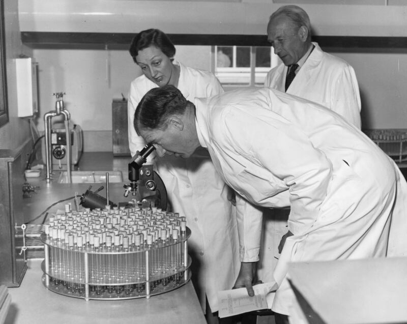 Health minister Dennis Vosper examining the polio virus in 1957, during the production of Polivirin, Britain's anti-poliomyletis vaccine, at Glaxo's Virus Research Laboratories in Stoke Poges.