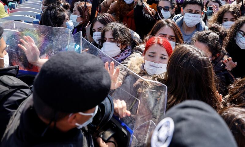 Activists scuffle with riot police as they are stopped in front of a police barricade to prevent them from attending a gathering to protest against Turkey's withdrawal from Istanbul Convention, an international accord designed to protect women, in Istanbul, Turkey. Reuters