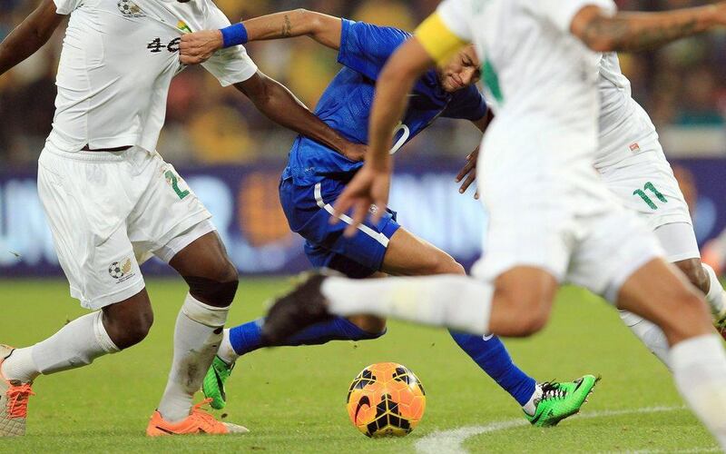 Neymar attacks for Brazil against South Africa on Wednesday March 5, 2014. Themba Hadebe / AP