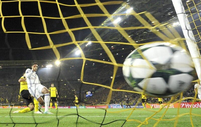 Real Madrid’s Raphael Varane, second left, scores his side’s second goal against Borussia Dortmund. Martin Meissner / AP Photo