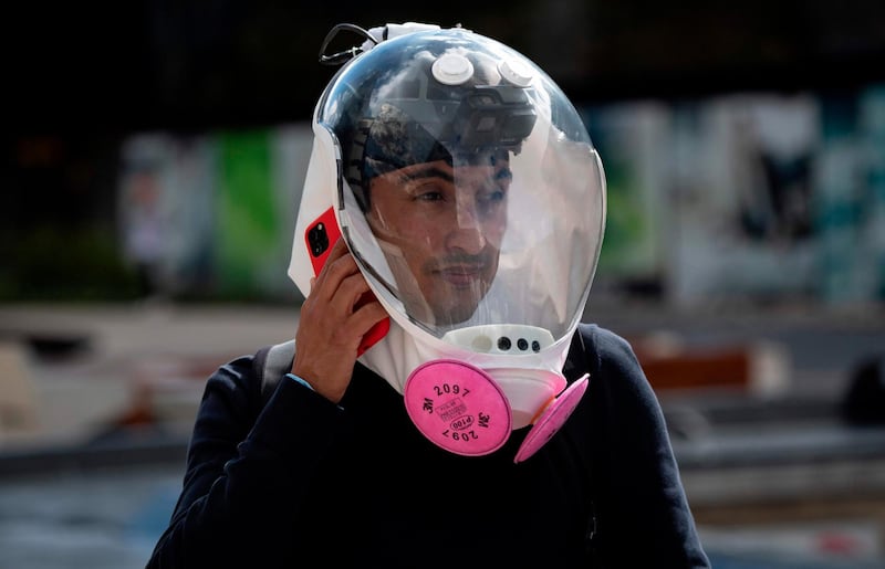 Colombian industrial designer Ricardo Conde wears his ventilation mask designed by him alongside a medical doctor and two aeronautical engineers in Bogota. AFP