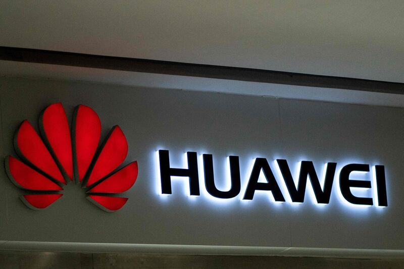 A Huawei logo is displayed at a retail store in Beijing on May 23, 2019. Chinese telecom giant Huawei says it could roll out its own operating system for smartphones and laptops in China by the autumn after the United States blacklisted the company, a report said on May 23. / AFP / FRED DUFOUR
