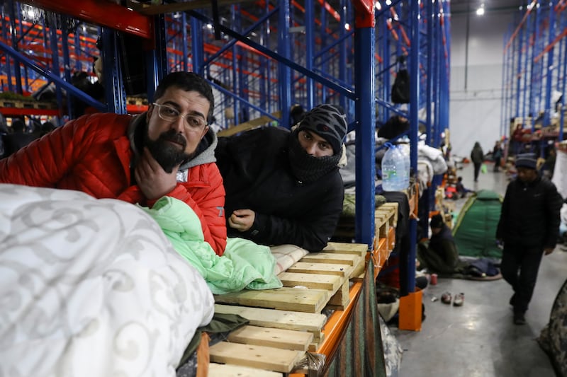 Migrants inside the transport and logistics centre on the Belarusian-Polish border, in the Grodno region.  Reuters