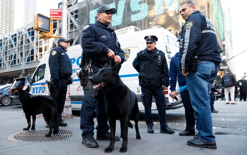 epa06383613 Police officers stand ouside the Port Authority Bus Terminal following an explosion inside an underground tunnel in the building in New York City, New York, USA, 11 December 2017. Reports indicate some injuries and that a suspect is in custody.  EPA/JUSTIN LANE