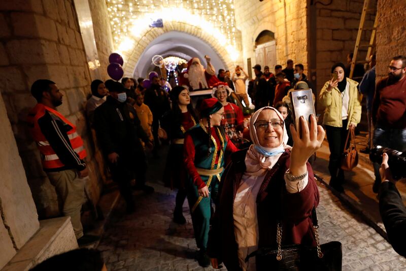 A Palestinian woman takes a selfie. Reuters