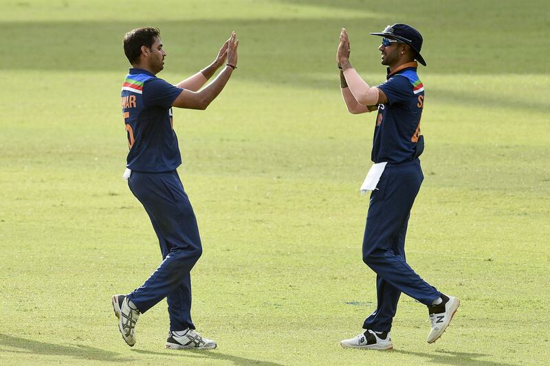 India's Bhuvneshwar Kumar, left, and captain Shikhar Dhawan were the star performers in the first T20 win over Sri Lanka on Sunday. AFP