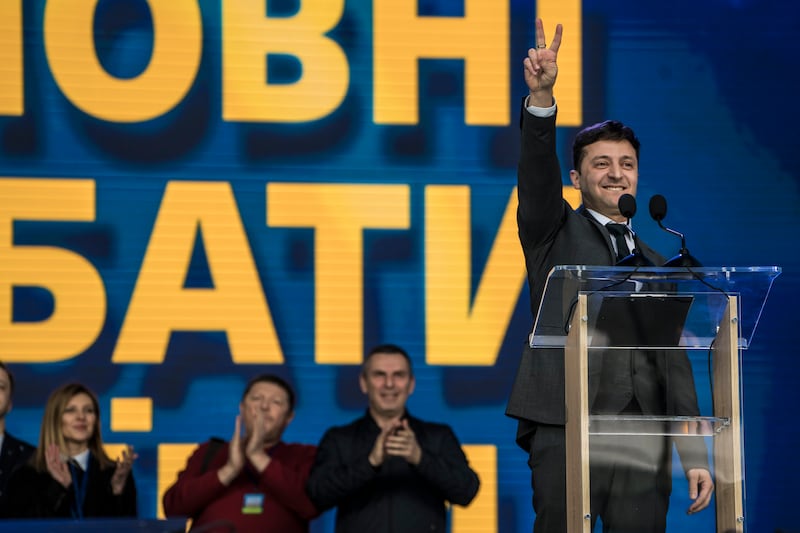 Mr Zelenskyy takes centre stage before a debate with then-president Petro Poroshenko at the Olympiskiy Stadium in April 2019 in Kyiv. Getty Images