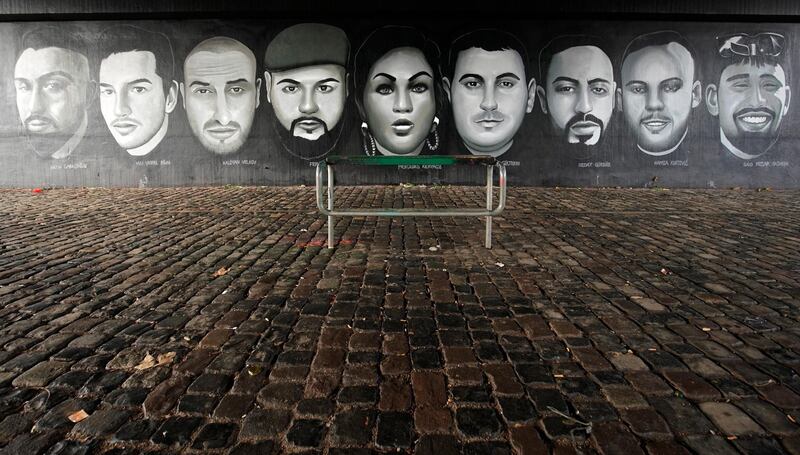 A mural of portraits of the victims of the shooting on a wall under a bridge in Frankfurt. EPA