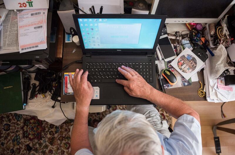 epa06911341 Attila Listvan (74) uses his computer in his home in Nyiregyhaza, Hungary, 23 July 2018 (issued 26 July 2018). Listvan is the organizer of many internet groups, and a keen documenter of the Szabolcs Folk Dance Group for decades. Older members of the family are also getting more and more comfortable in the digital world, with the use of two or more devices in their households to browse and keep in touch online.  EPA/Attila Balazs HUNGARY OUT ATTENTION: This Image is part of a PHOTO SET