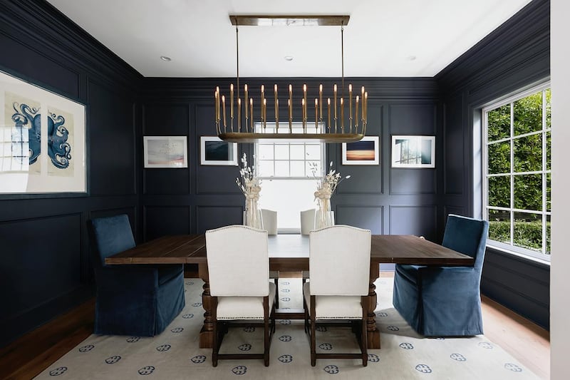 Deep blue decor in the separate dining room, which opens on to the garden. Courtesy Engel & Volkers