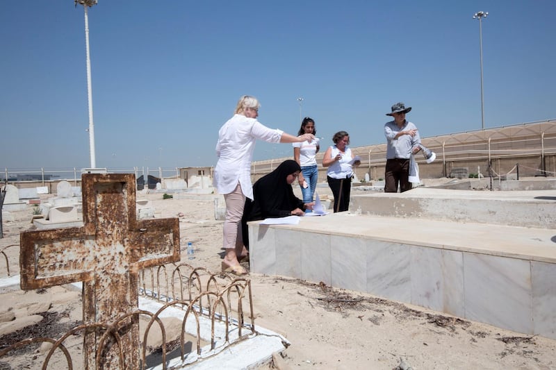 ABU DHABI, UNITED ARAB EMIRATES - Prof. Athol Yates of Khalifa University with his team at Sas Al Nakhel Cemetery, Non Muslim.  Ruel Pableo for The National for John Dennehy's story