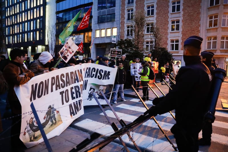 People gather to demonstrate against the arrival of Turkish President Erdogan in Brussels, Belgium.  EPA