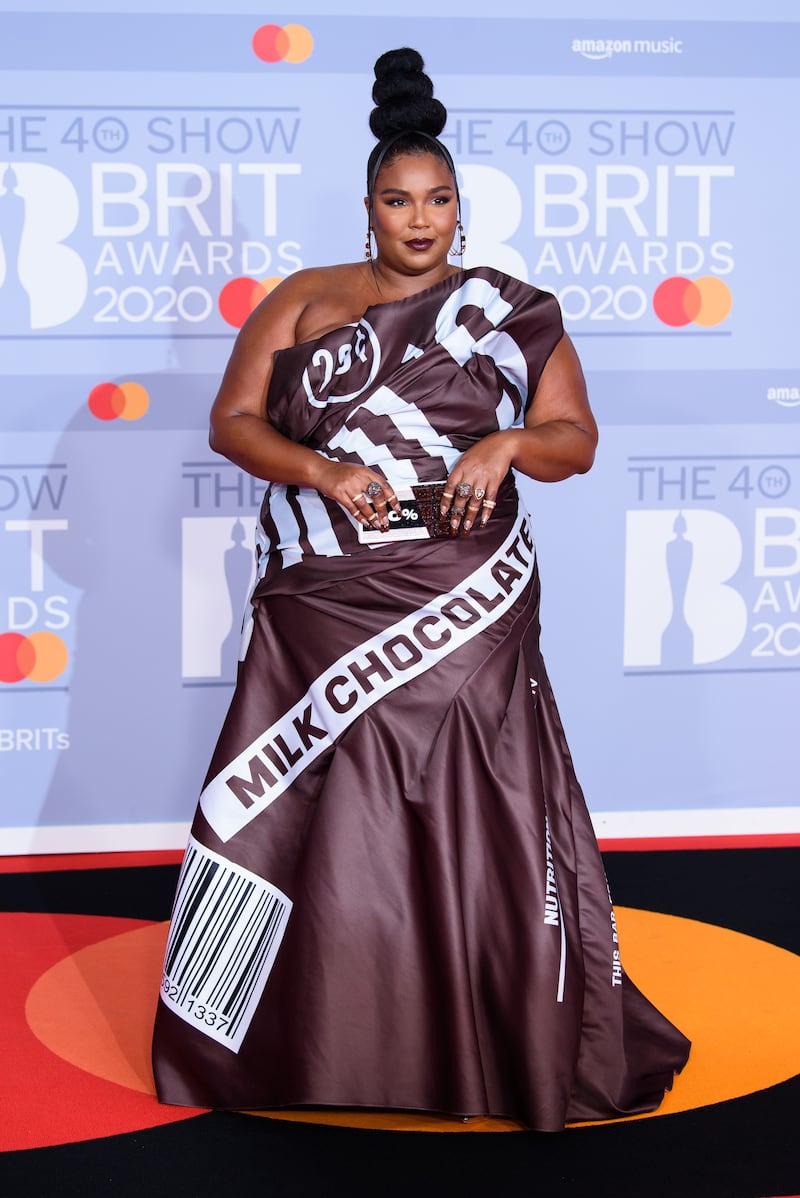 Lizzo in a chocolate bar-inspired gown by Jeremy Scott for Moschino at the Brit Awards 2020. Getty Images