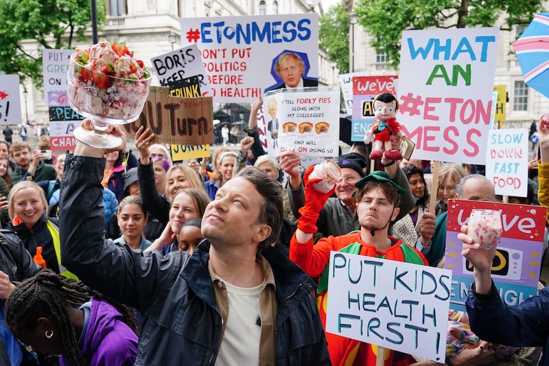 Celebrity chef Jamie Oliver takes part in the 'What An Eton Mess' demonstration outside Downing Street, London on Friday, calling for Prime Minister Boris Johnson to reconsider his U-turn on the government's anti-obesity strategy. PA