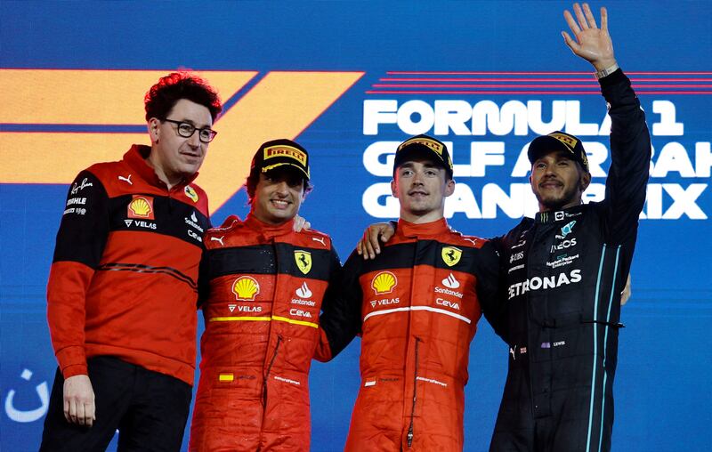 Ferrari's Charles Leclerc celebrates on the podium after winning the race with second place Carlos Sainz and third place Lewis Hamilton and Ferrari team principal Mattia Binotto. Reuters