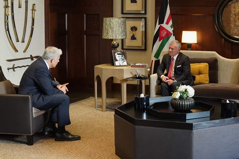 Jordan's King Abdullah II, right, and Israeli Foreign Minister Yair Lapid speak in Amman. AFP