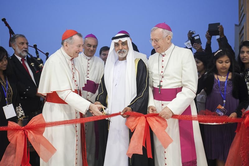 Sheikh Nahyan bin Mubarak, Minister of Youth, Culture and Community Development, is joined by Cardinal Pietro Parolin, left, and Bishop Paul Hinder, right, at the inauguration and blessing of St Paul's Church in Mussaffah on Thursday.  Mona Al Marzooqi / The National