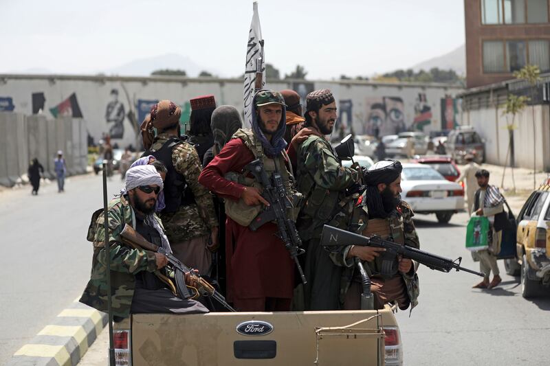 Taliban fighters patrol in Kabul.  AP