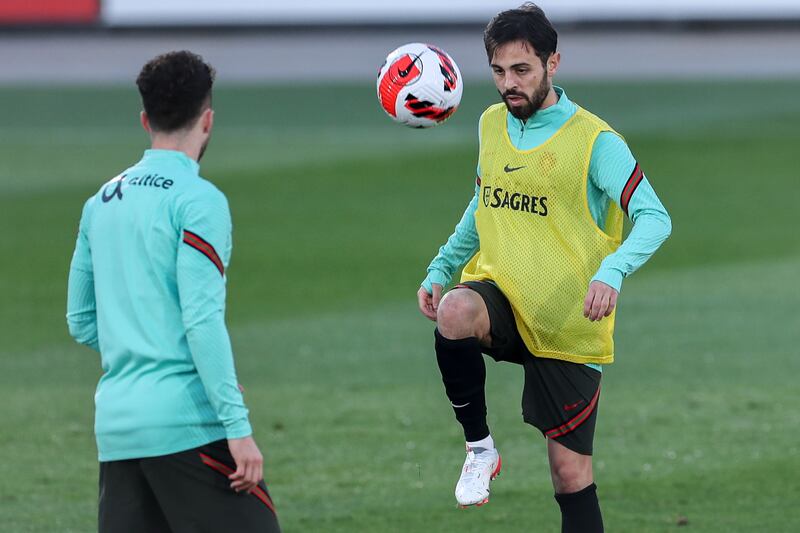 Portugal national soccer team players Bernardo Silva and Jota (R) during a training session in Oeiras, near of Lisbon, Portugal, 12 November 2021.  Portugal will face Serbia on 14th, in their FIFA World Cup Qatar 2022 qualifying group A soccer match, in Lisbon, Portugal.   EPA / ANTONIO COTRIM
