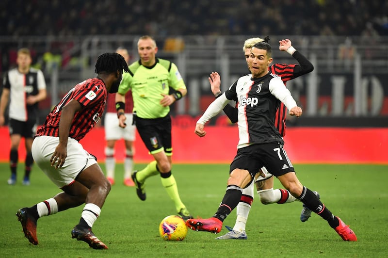 Cristiano Ronaldo runs at the Milan defence. AP