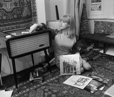 FILE - 4 APRIL 2020: Singer Marianne Faithfull, 74, has been hospitalised with COVID-19 in London 15th October 1964:  Marianne Faithfull playing records at her home in Reading. Among the records scattered on the floor are albums by Pete Seeger and Manfred Mann.  (Photo by John Pratt/Keystone Features/Getty Images)