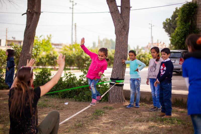 Crossing Lines has organised two trips to Bekaa Valley in Lebanon to work with refugees in informal tented settlements, setting up slacklines and providing lessons to local children. Courtesy Crossing Lines