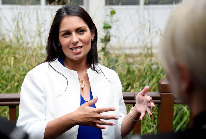 FILE PHOTO: Britain's Home Secretary Priti Patel gestures as she speaks during a visit to the West Midlands Police Learning & Development Centre in Birmingham, Britain July 26, 2019. REUTERS/Toby Melville/Pool/File Photo