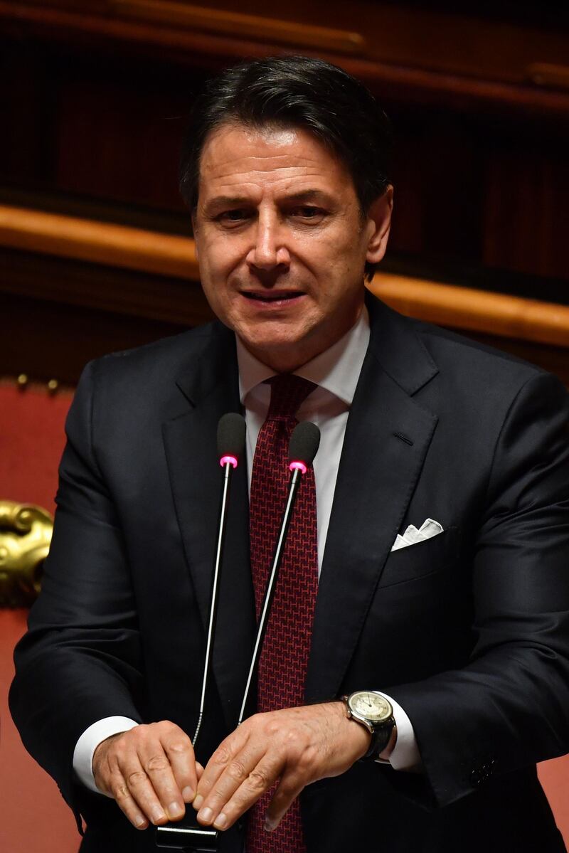 Italian Prime Minister Giuseppe Conte gestures as he delivers a speech at the Italian Senate, in Rome, on August 20, 2019, as the country faces a political crisis. On August 20, 2019 Italian Prime Minister says he will offer his resignation to the Senate, lashing out at Salvini for pursuing his own interests by pulling the plug on the coalition. / AFP / Andreas SOLARO
