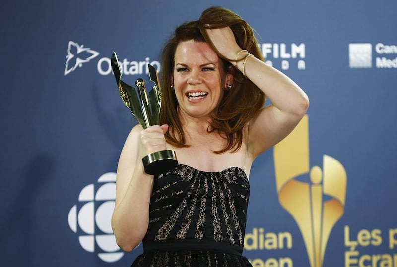 Actress Tracy Dawson holds her award for Best Performance by a Lead Comedic Role for Call Me Fitz. Mark Blinch / Reuters