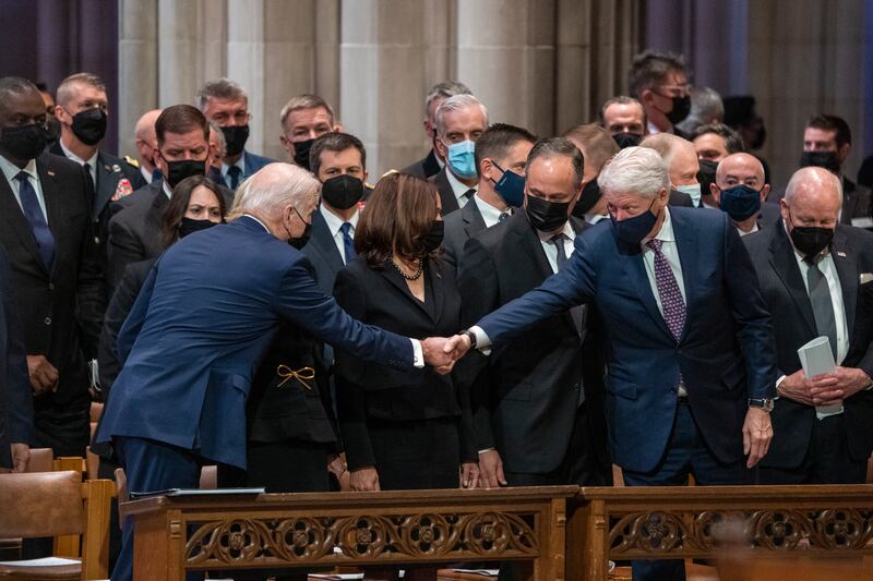 US President Joe Biden greets former president Bill Clinton at the funeral. EPA