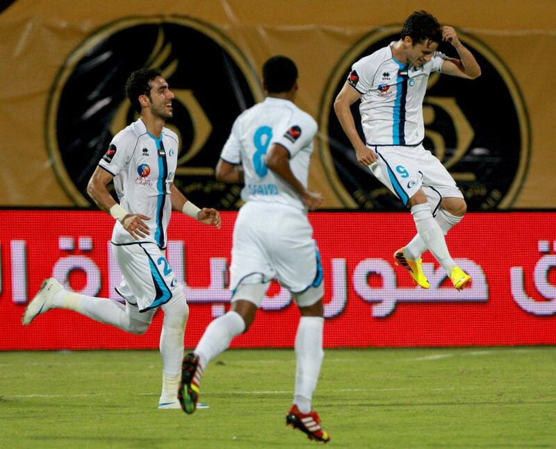 This is a sight Baniyas fans are getting used to -  Marcelo Pereira, right, celebrating a goal. He, along with Carlos Munoz and Luis Farina, have led the team's foreign legion. Satish Kumar / The National