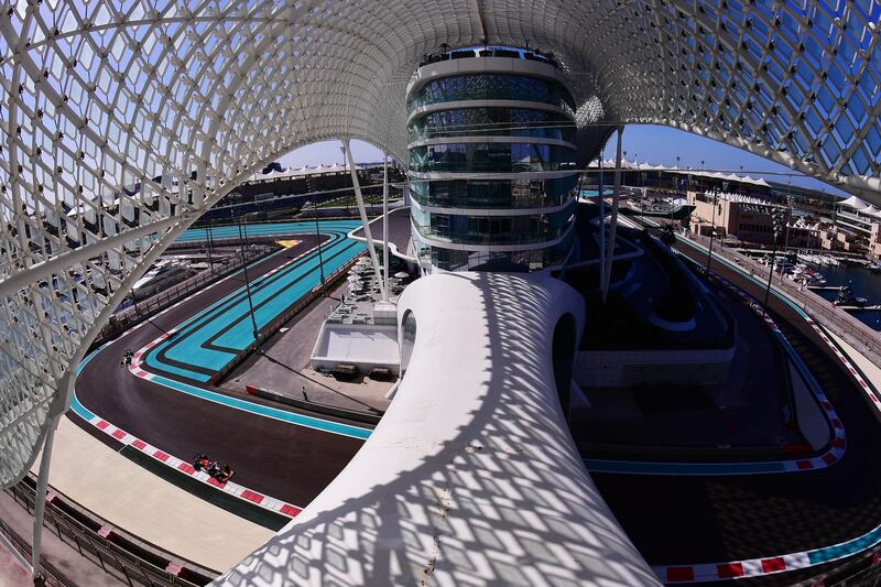 ABU DHABI, UNITED ARAB EMIRATES - DECEMBER 11: A general view of the circuit as Alexander Albon of Thailand is seen driving the (23) Aston Martin Red Bull Racing RB16 on track during practice ahead of the F1 Grand Prix of Abu Dhabi at Yas Marina Circuit on December 11, 2020 in Abu Dhabi, United Arab Emirates. (Photo by Giuseppe Cacace - Pool/Getty Images)