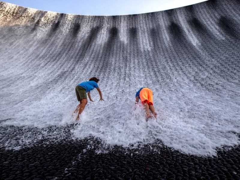 Visitors enjoy the Expo 2020 Water Feature area. Victor Besa/The National.