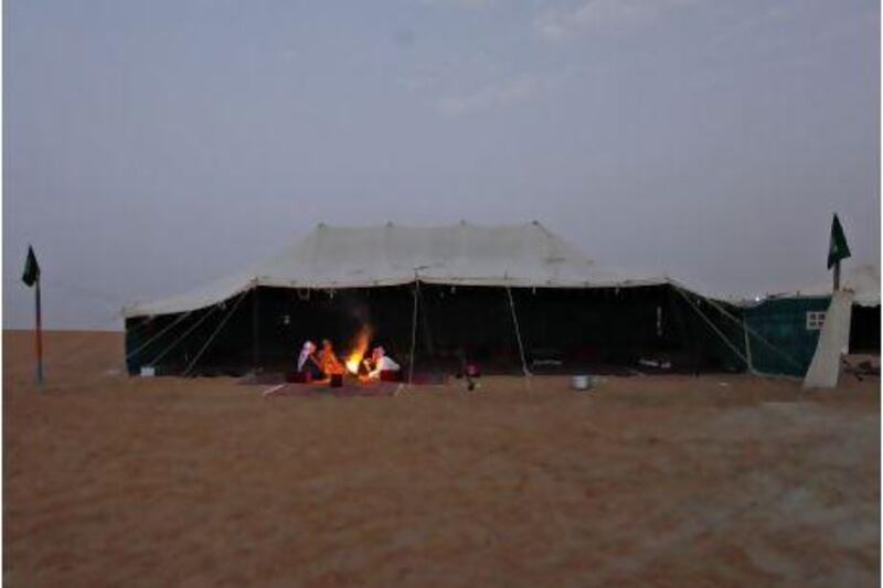 Saleh Al Dossary at his camp with relatives and friends at Al Dhafra Festival. Jeff Topping / The National